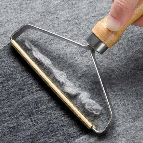 Hand using a glass cleaning tool on a smartphone screen