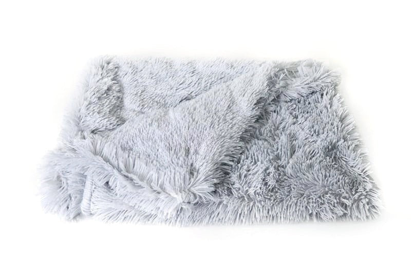 Fluffy gray rug on a white background