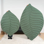 showing two green  leaf-shaped dog blanket.