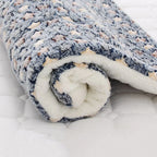 Rolled-up soft fleece pet blanket with pattern for comfort