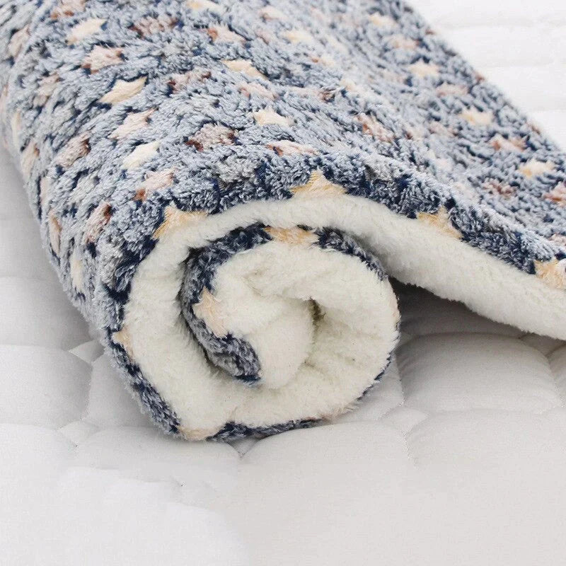 Rolled-up soft fleece pet blanket with pattern for comfort