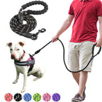 a man with his dog wearing reflective dog leashes 